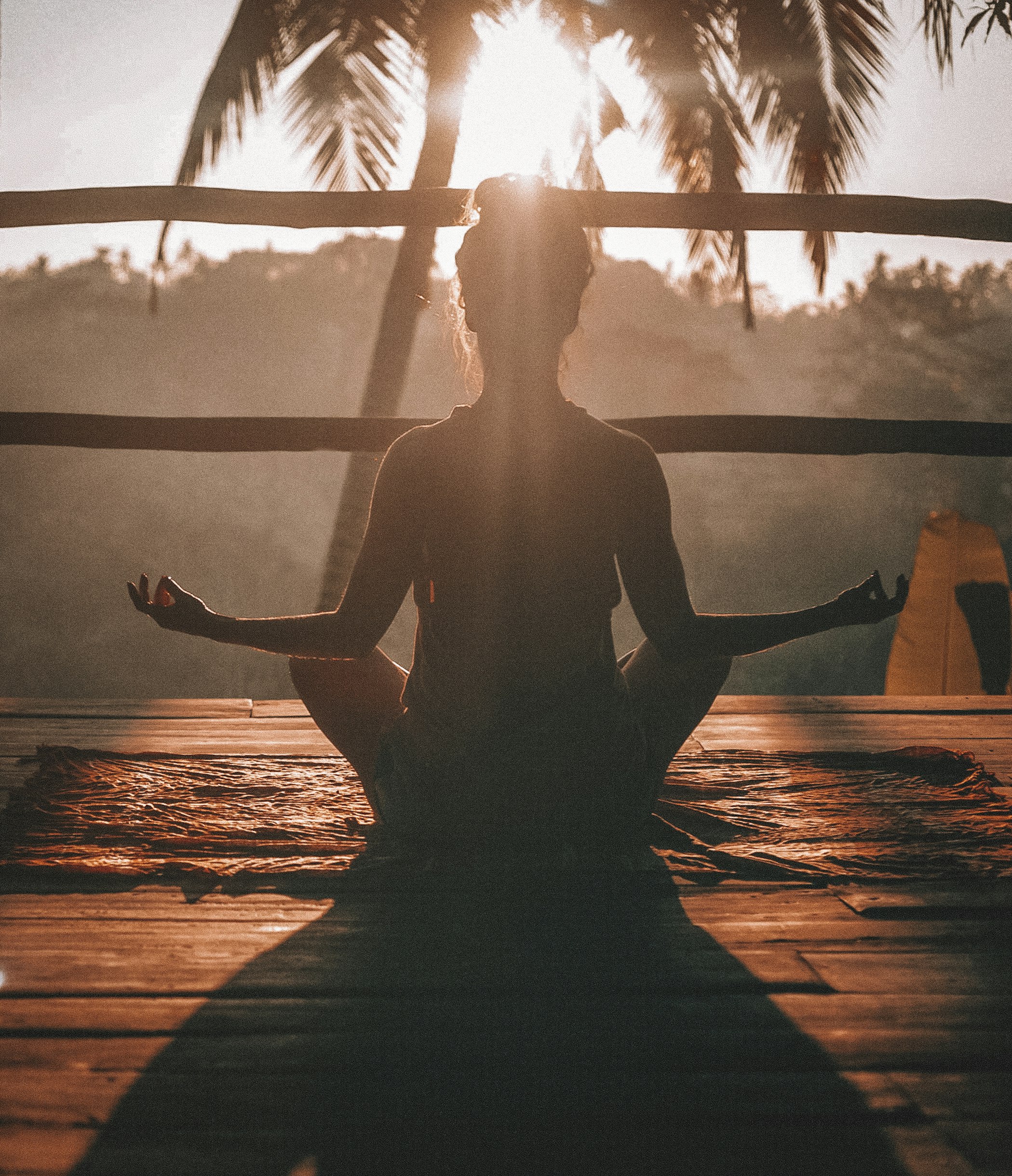 Person meditating after yoga session, representing mental benefits of exercise